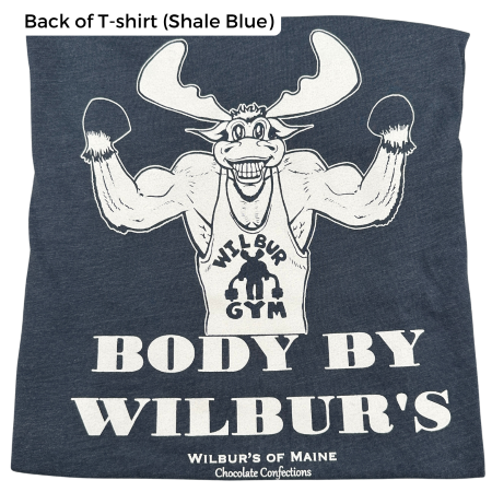 A t-shirt in shale blue with a moose showing off his muscles. The text reads "Body By Wilbur's" and "Wilbur's of Maine Chocolate Confections"