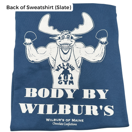 A crewneck in slate with a moose showing off his muscles. The text reads "Body by Wilbur's" and "Wilbur's of Maine Chocolate Confections"