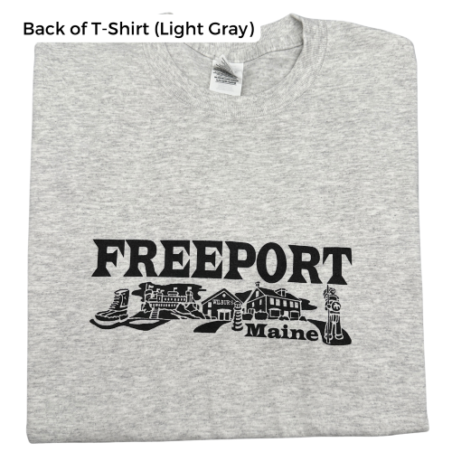 A light gray t-shirt with the text "FREEPORT" The graphic includes famous Freeport destinations- LLBean, Casco Castle, Wilbur’s of Maine & the BFI