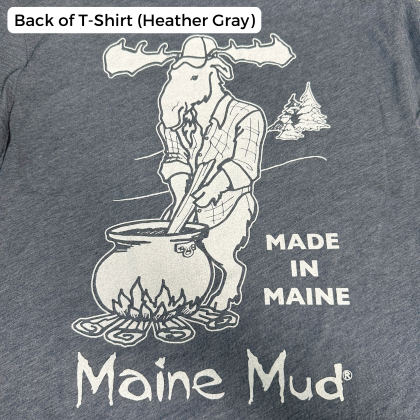 An deep gray t-shirt design with a moose in a flannel stirring a large pot of caramel over a campfire. The text reads "Made in Maine" and "Maine Mud"